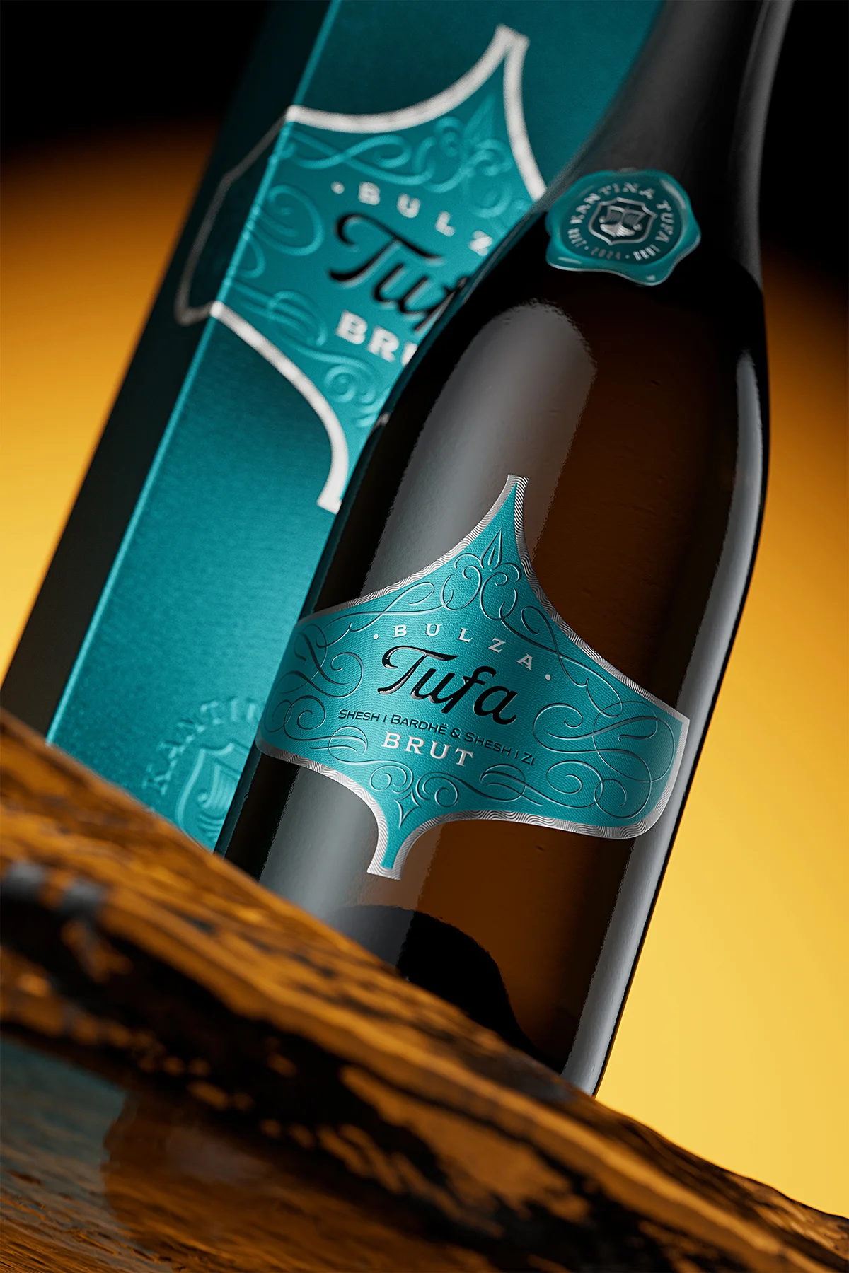Tufa Bulza premium sparkling wine bottle on dark wood surface, teal label with silver foil contouring and calligraphic ornaments