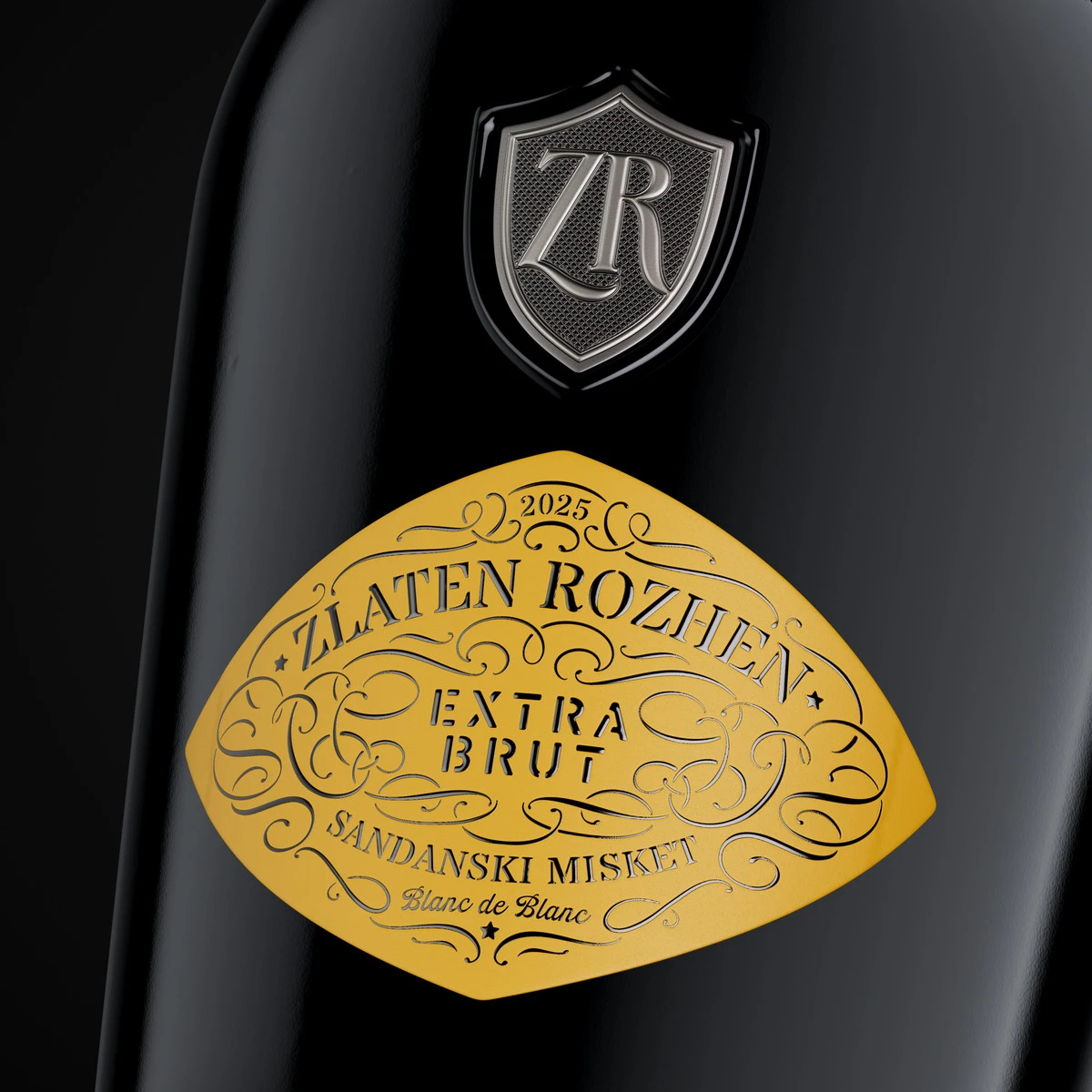 Close-up of the Zlaten Rozhen Extra Brut Blanc de Blancs diamond label with stencil typography, a hand-drawn ornamental frame and relief varnish on yellow soft-touch paper