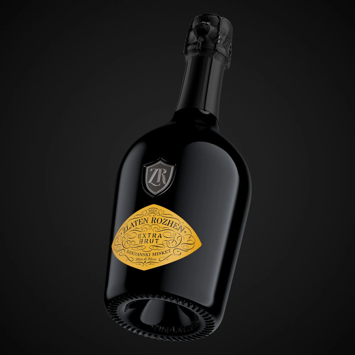 A Zlaten Rozhen Blanc de Blancs bottle tilted against black, showing the heavy Italian-style bottle, deep punt, black matte capsule and diamond-shaped yellow label