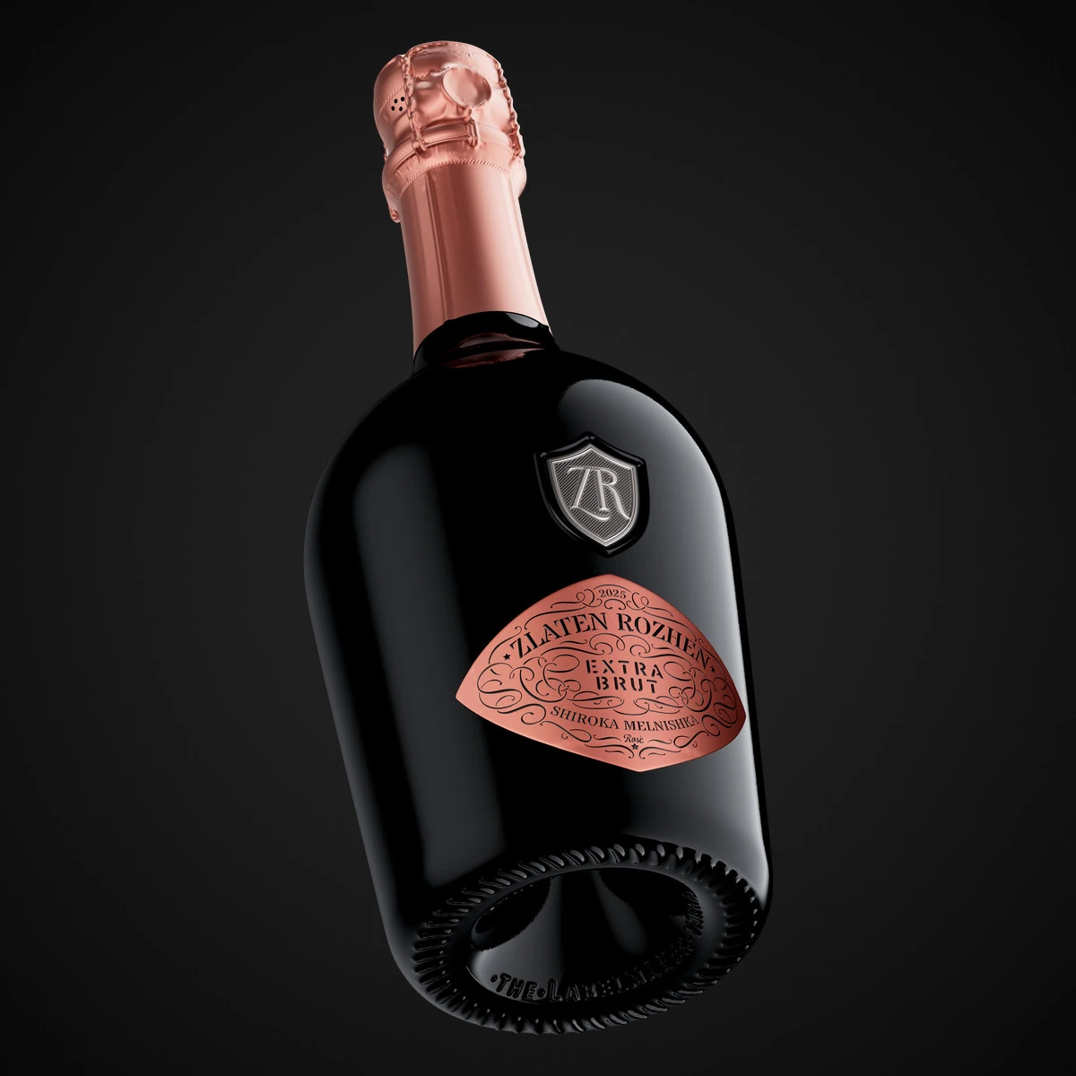 A Zlaten Rozhen Rosé sparkling wine bottle tilted against black, with a semi-matte pink capsule and a pink metallic diamond label